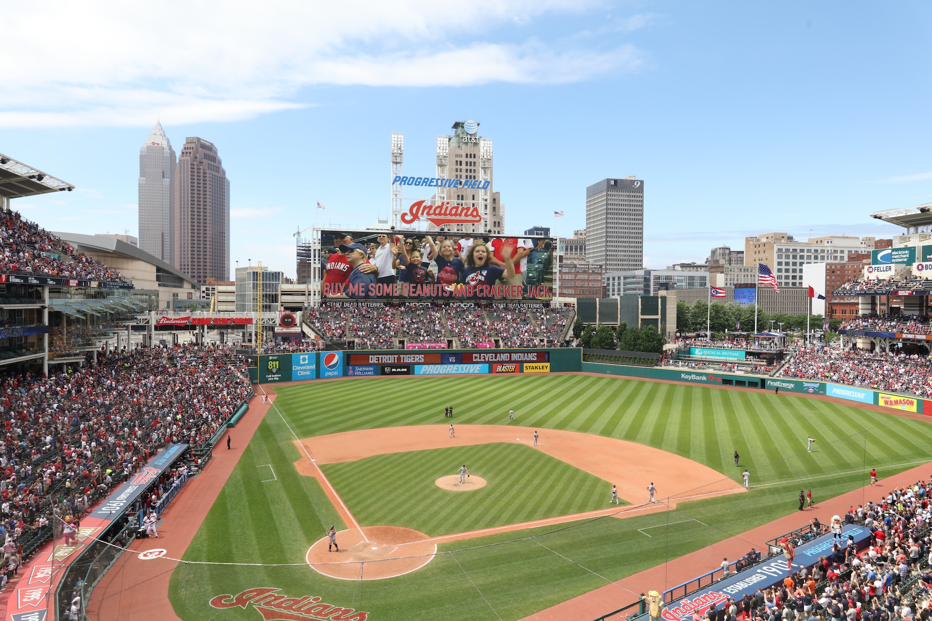 A photograph of Progressive Field's baseball diamond, with the scoreboard in the background.