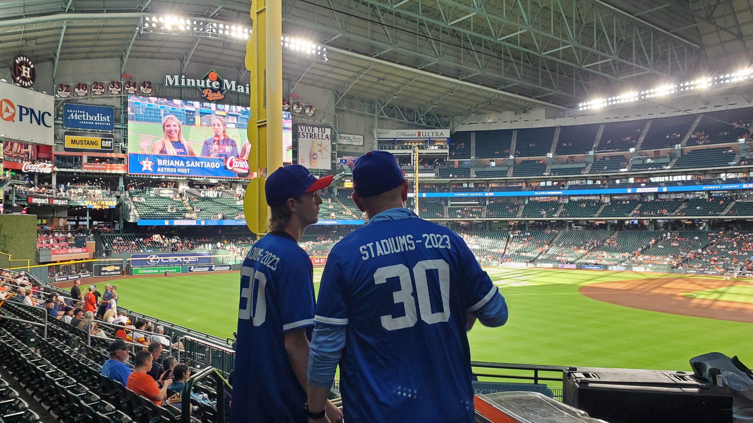 Ryan and Brad looking out at Minute Maid Park from the concourse.