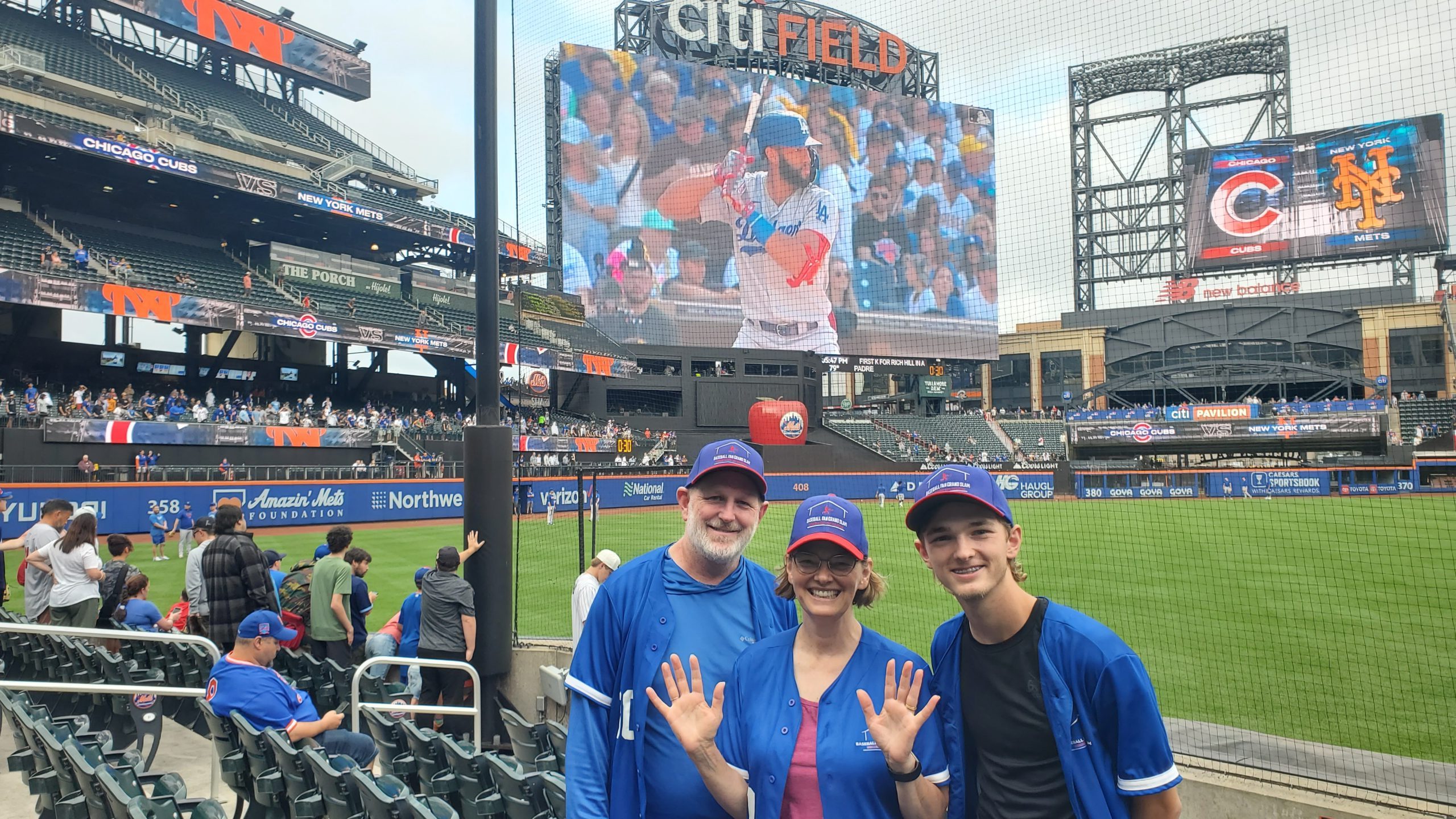 Photo of Brad, Heather and Ryan in front of the diamond at Citi Field.