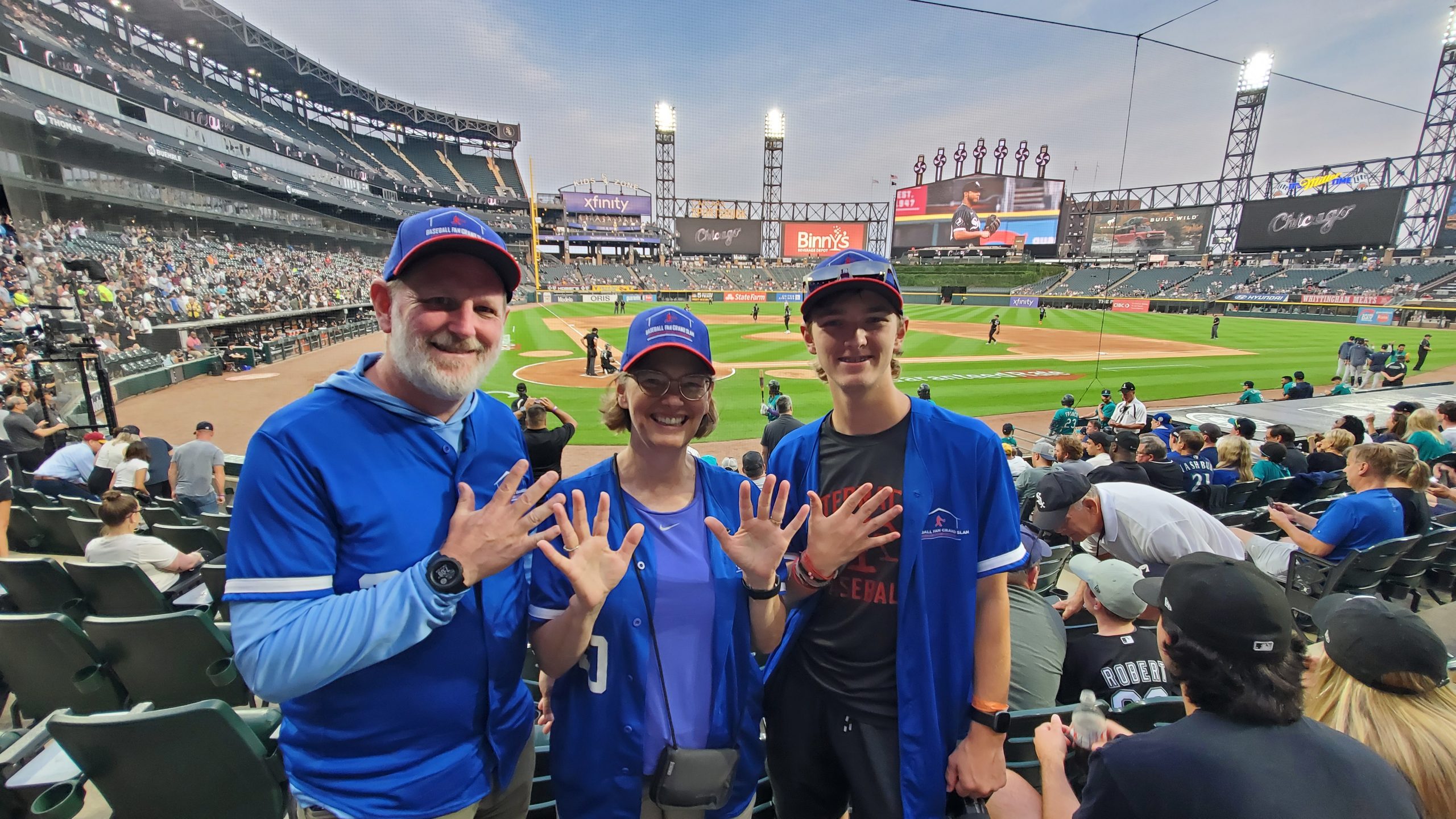 Heather, Brad and Ryan with 20 fingers, representing the 20th stadium visit, at Guaranteed Rate Field.