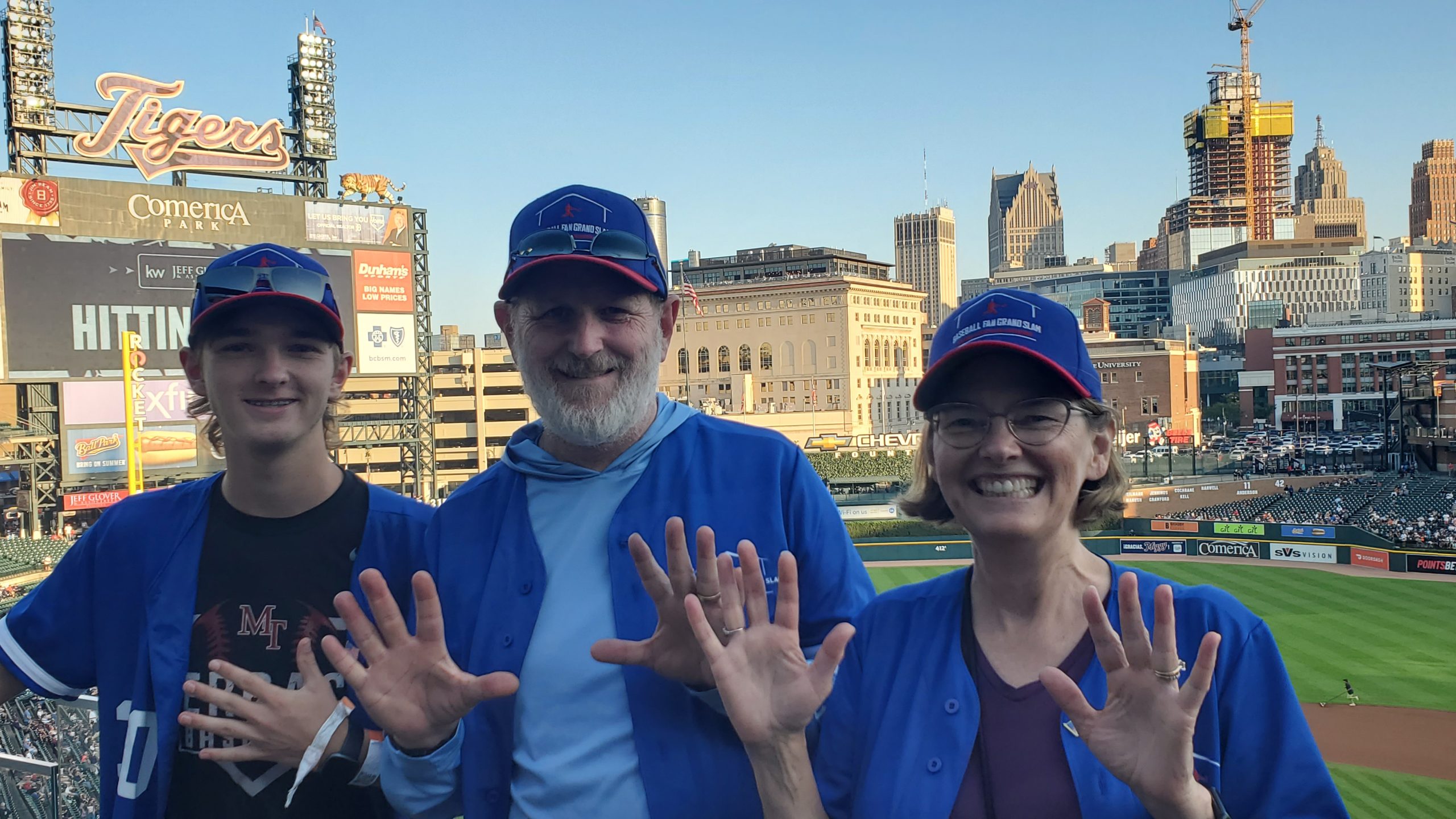 Heather, Brad, and Ryan at Comerica Park with 25 fingers in the air!