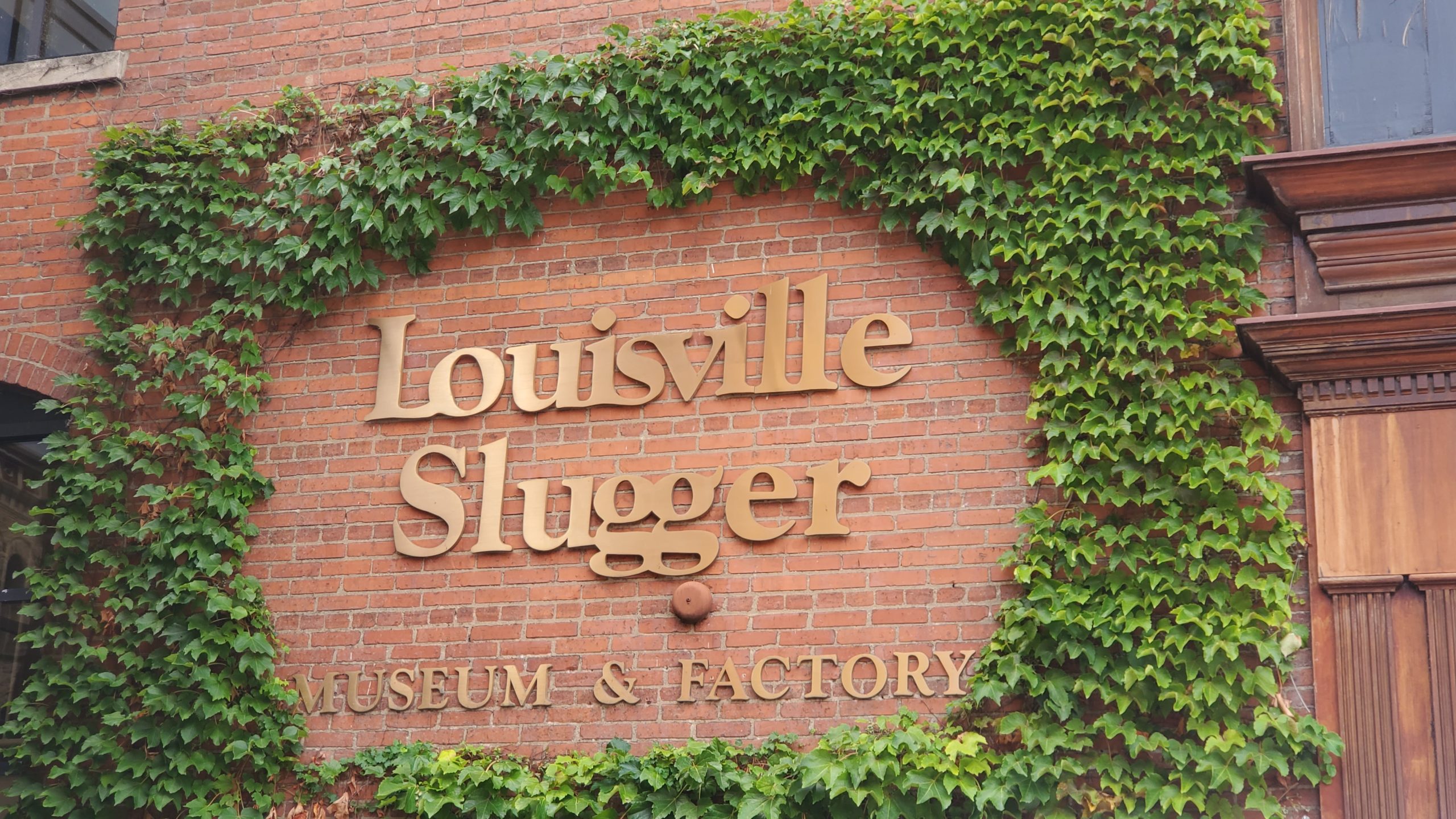 Photograph of the Louisville Slugger Museum and Factory sign.