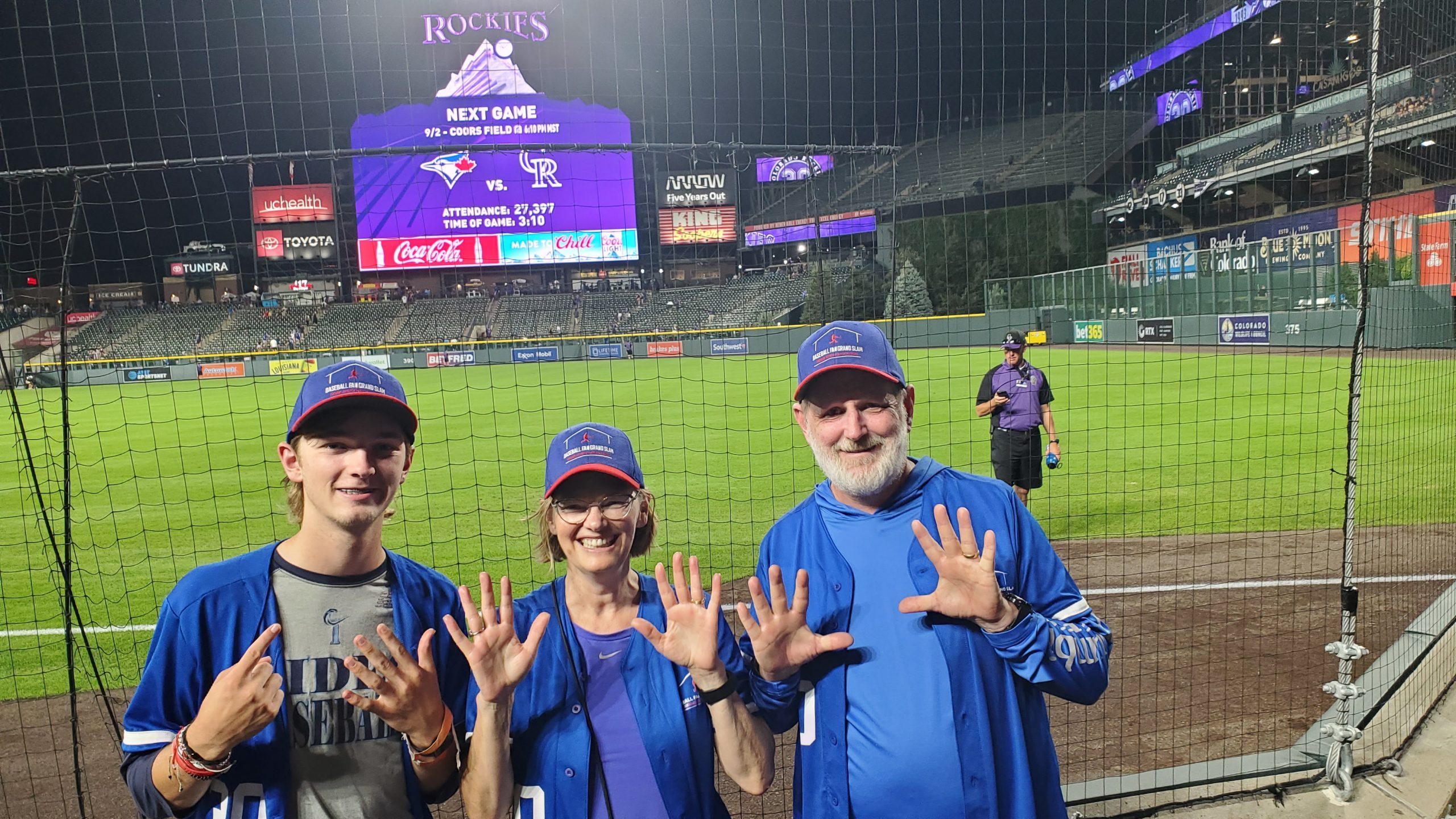 Brad, Heather and Ryan at Coors Field holding up 26 fingers!